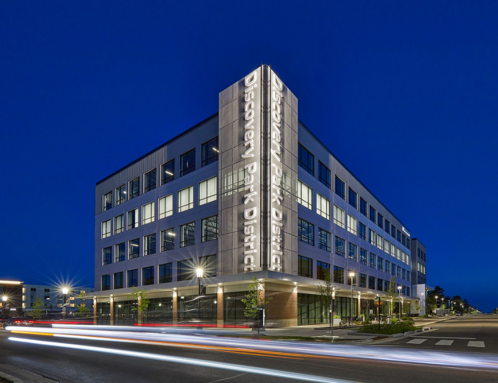 A wide shot of Convergence Center taken from Mitch Daniels Blvd at night - Discovery Park District at Purdue - Purdue Research Foundation