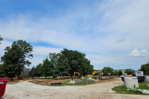 A construction site with heavy machinery on a sunny day.
